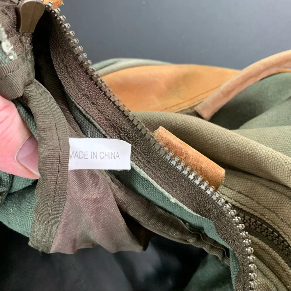 High Sierra Green canvas and Brown leather Duffel Bag.